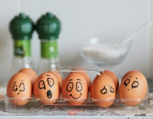 eggs with emotional faces drawn on them
