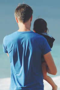 Picture of father and child looking out to sea