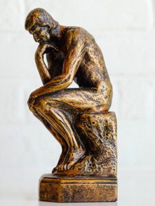 small thinker statue cast