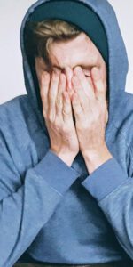 Stressed guy in a hoody