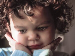 Child in thought after being given choices