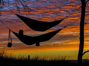 relaxing in a hammock at sunset