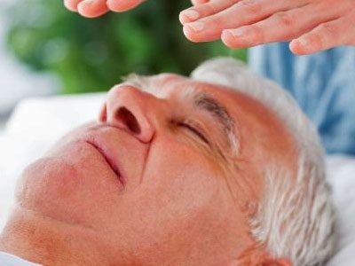 hovering reiki hands over the head