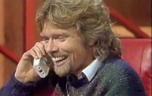 Richard businessman answering the telephone smiling