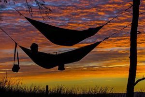 relaxing in a hammock at sunset